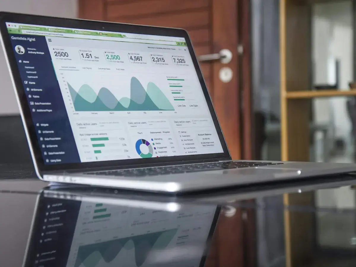 Laptop showing a website analytics dashboard with conversion charts